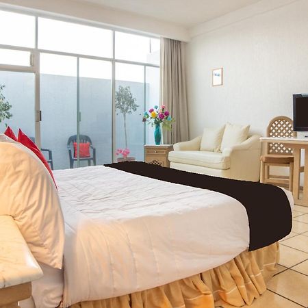 Capital O Hotel Villa Monini Пуебла Екстериор снимка